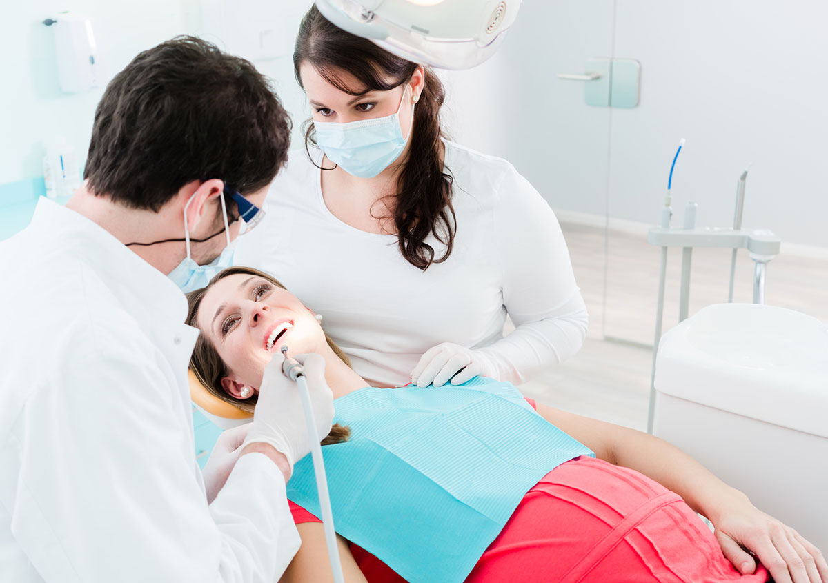 A woman is having dental treatment