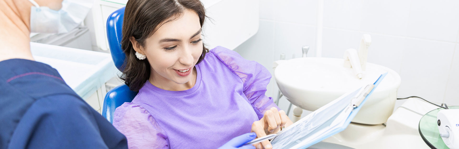 A woman is having comprehensive exams at dental