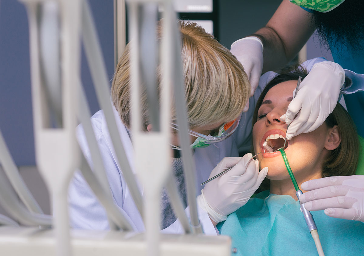 A woman is having dental surgery