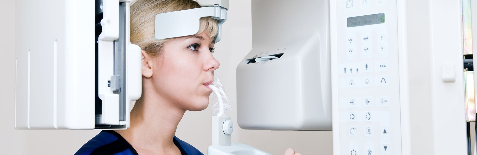 A woman is having dental x-ray